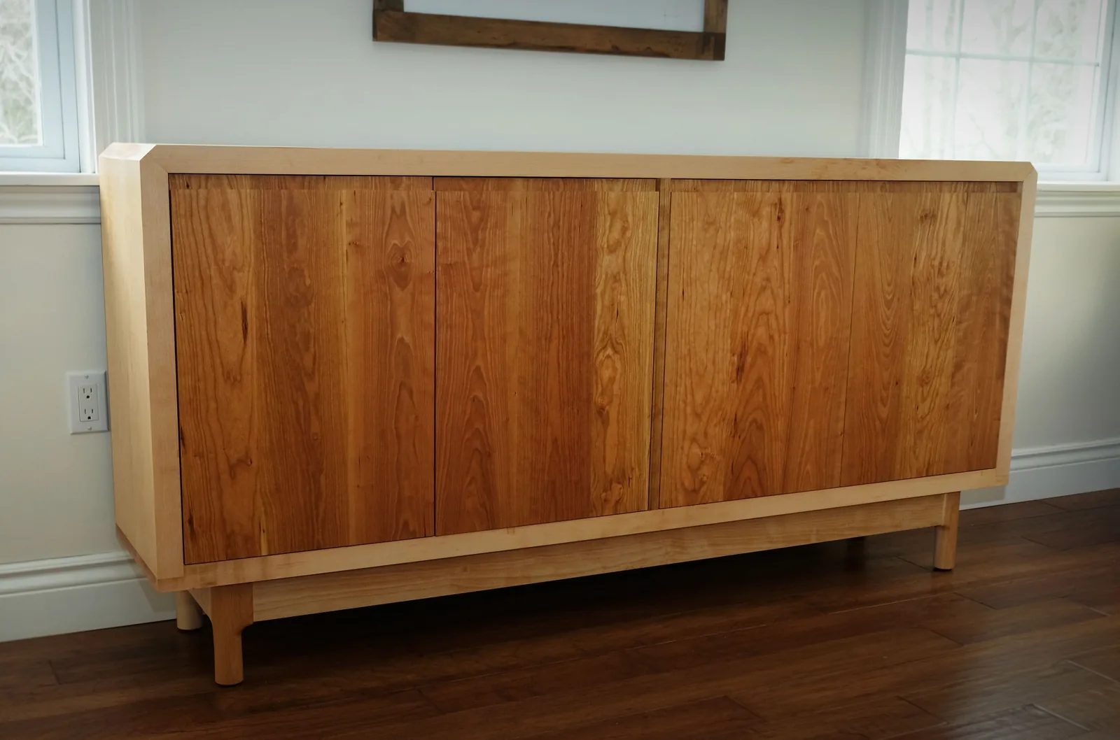 Low credenza in maple and cherry in a living room